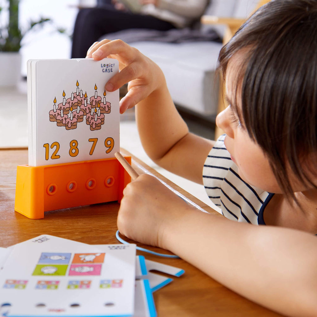 HABA Logic! CASE Starter Set 6+ – 77 Brain Teaser Puzzles for Kids, Travel Game with Self-Checking Wooden Peg