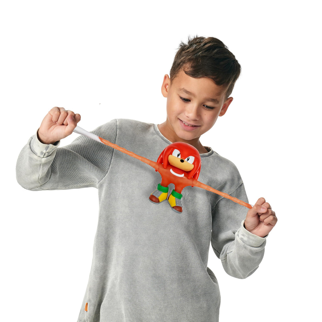 Heroes of Goo Jit Zu Unstoppable Surge Knuckles – Glow-in-the-Dark Stretchy Action Figure with Bead Filling