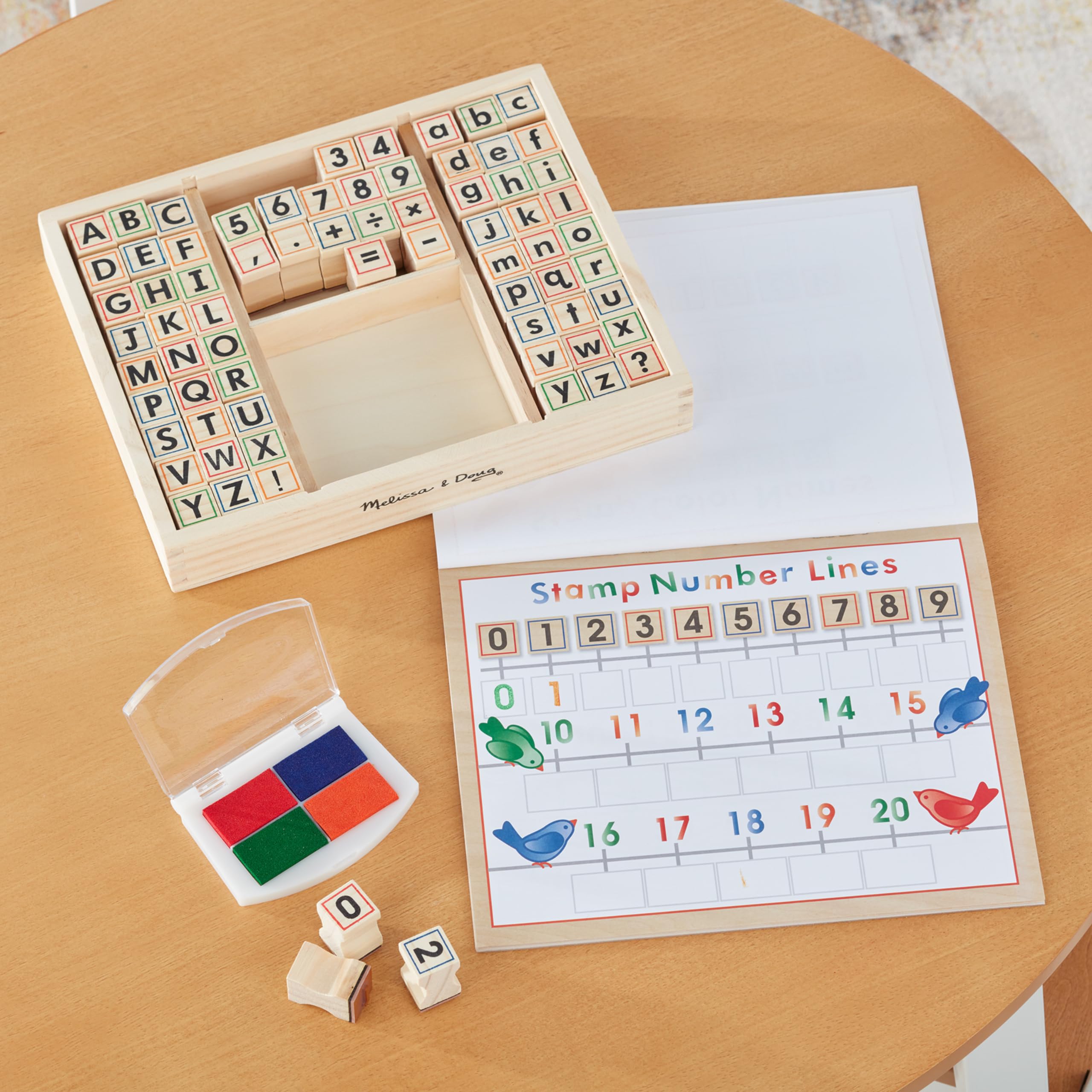 Melissa & Doug Deluxe Letters and Numbers Wooden Stamp Set – 71 Stamps, 4-Color Ink Pad, Activity Book (Ages 4-8)